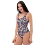 Woman wearing a purple butterfly swimsuit.