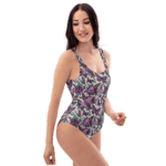 Woman wearing a floral butterfly swimsuit.