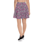 Woman wearing a floral skater skirt.