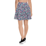 Woman in floral skirt and sneakers.