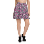 Woman wearing a pink floral skater skirt.