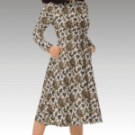 Woman in floral print dress with pockets.