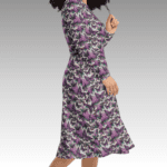 Woman wearing a purple butterfly dress.