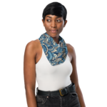 Woman wearing a blue and gold patterned scarf.