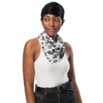 Woman wearing black and white floral scarf.