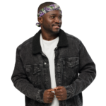 Man wearing a denim jacket and bandana.