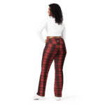 Woman in white top and red plaid pants.