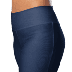 Woman wearing dark blue leggings.