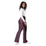 Woman in white shirt and plaid pants.