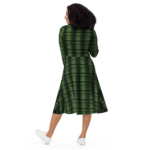 Woman in green plaid dress from behind.