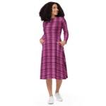 Woman in pink plaid dress with white sneakers.