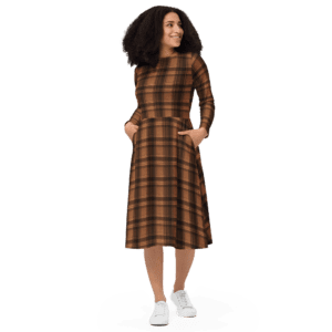 Woman in a brown plaid dress and white sneakers.