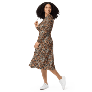 Woman in floral dress and white sneakers.