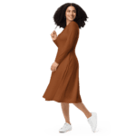 Woman in brown dress and white sneakers.