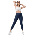 Woman in navy leggings and white sports bra.