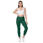 Woman wearing green high waisted leggings.