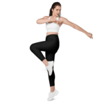 Woman in black leggings and white top exercising.