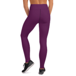 Woman wearing purple leggings and sneakers.