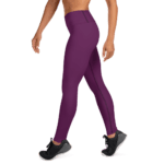 Woman wearing purple leggings and sneakers.