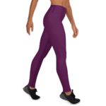 Woman wearing purple leggings and black shoes.