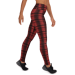 Red and black plaid leggings on a model.