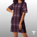 A woman in purple plaid dress standing next to a wall.