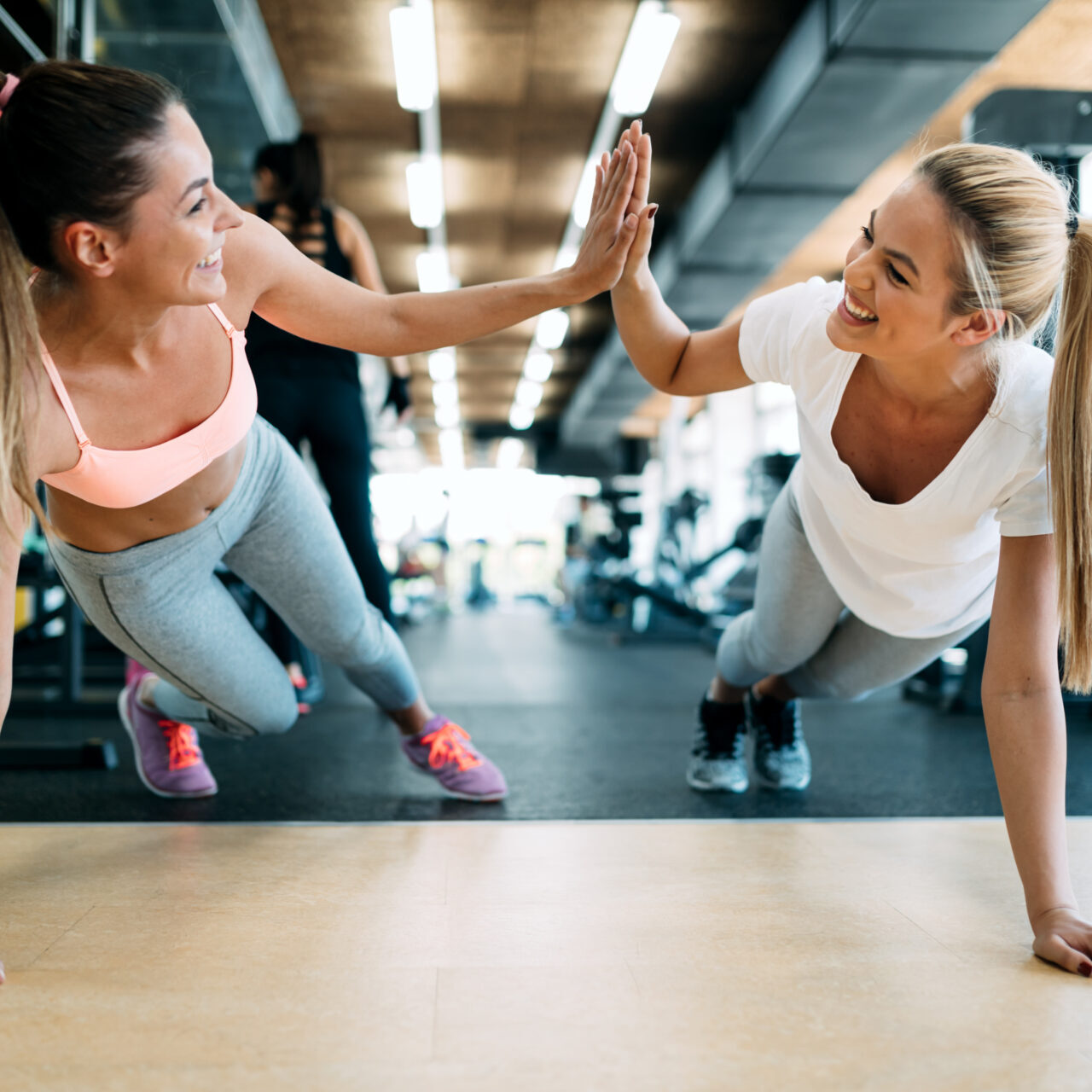 Women high five, fitness, gym, workout, weight