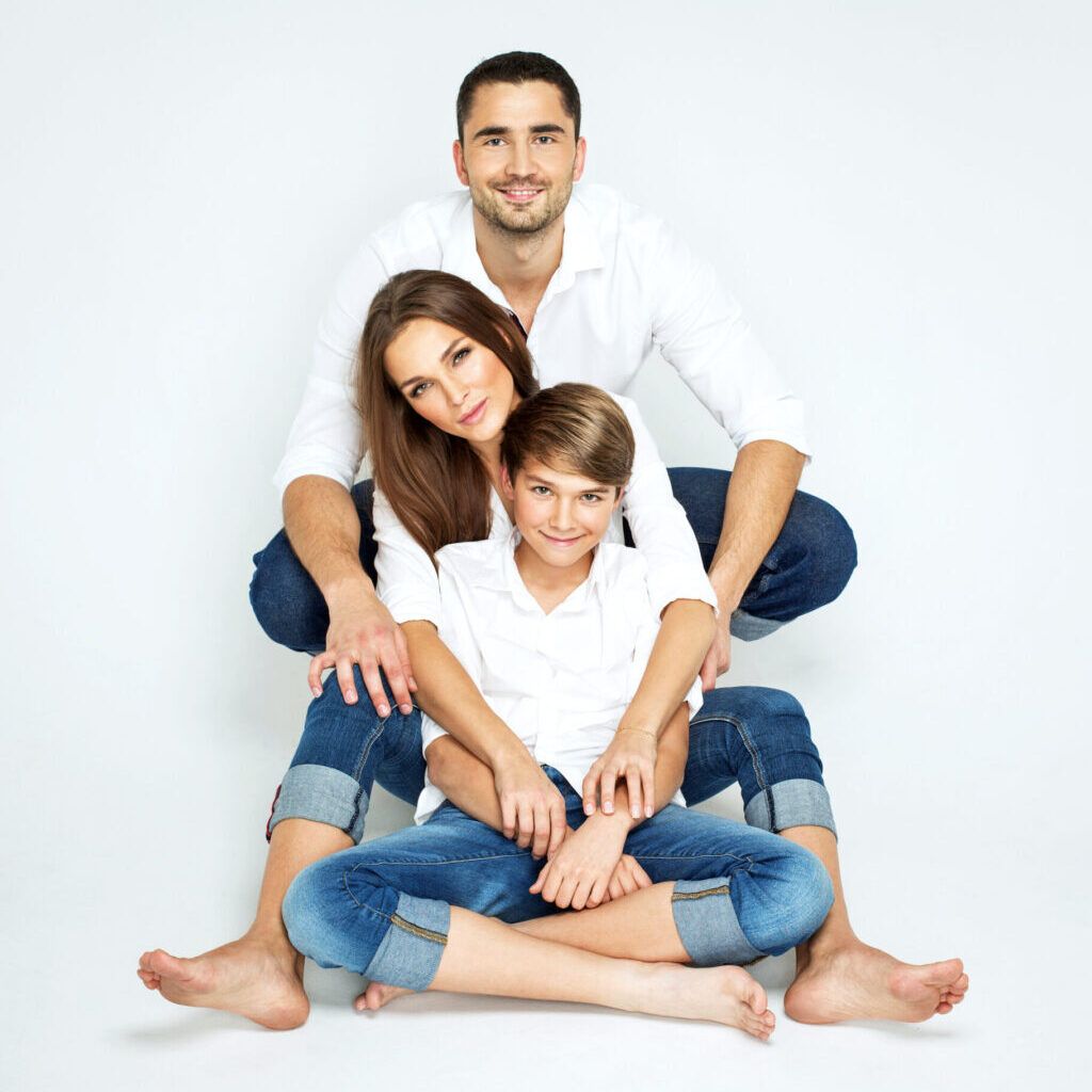 Young happy family on white background